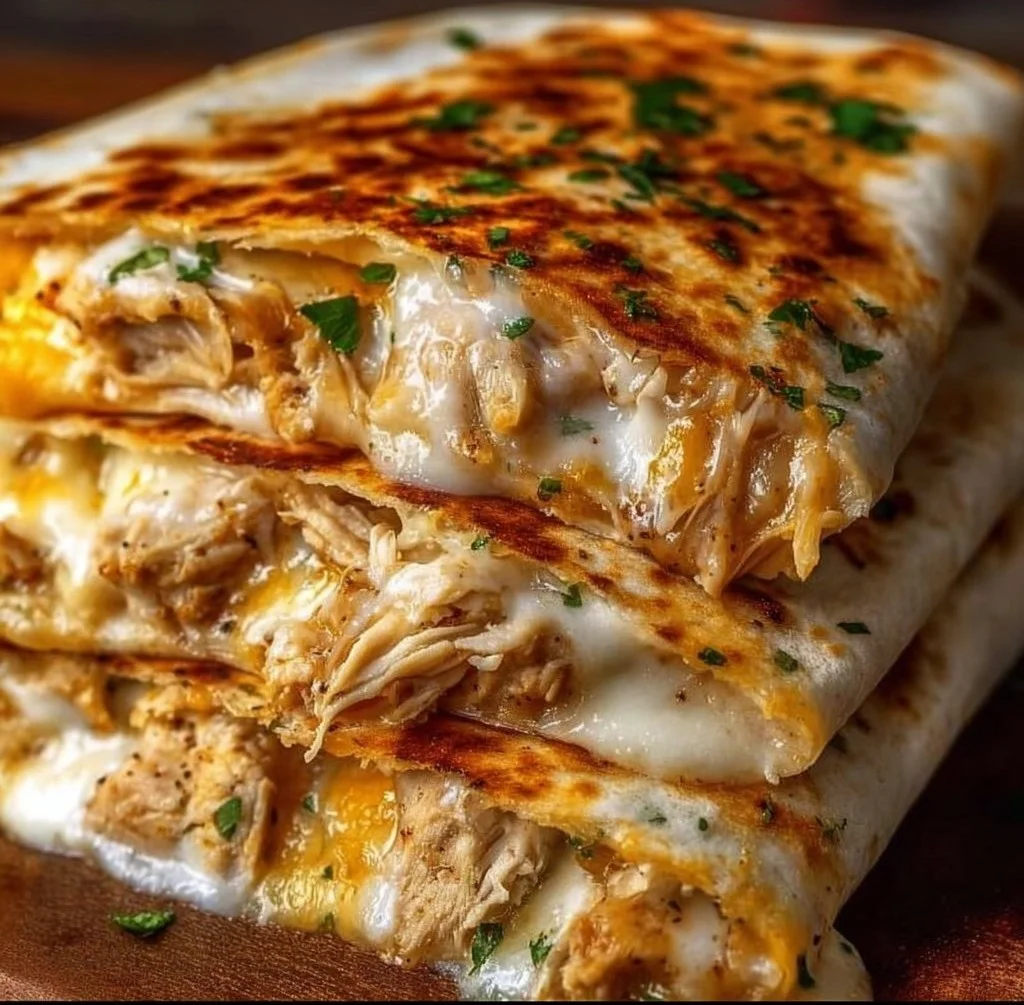 Delicious cheesy garlic chicken wraps ready to serve.