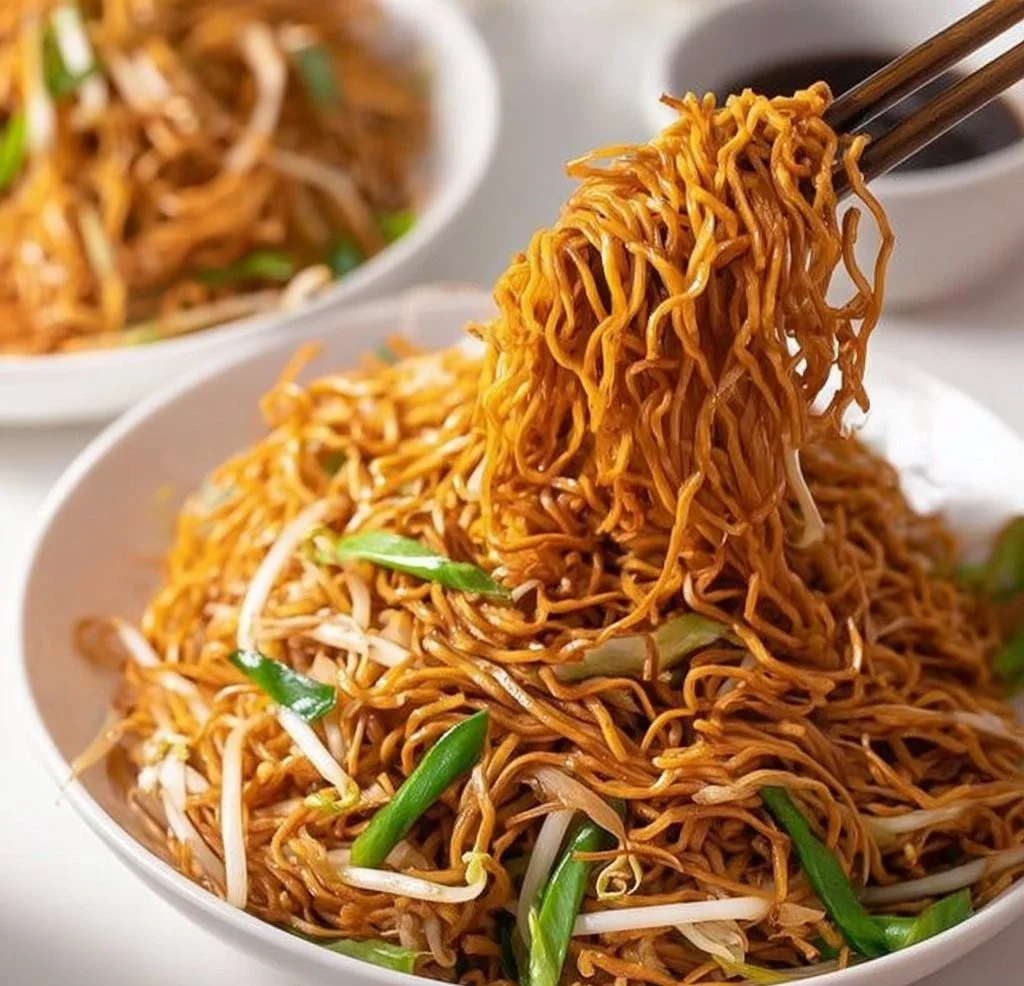 A delicious plate of Classic Chinese Chow Mein with vegetables and crispy noodles.