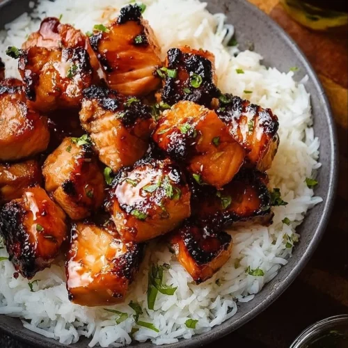 Air Fryer Bang Bang Salmon Bites served on a plate with dipping sauce
