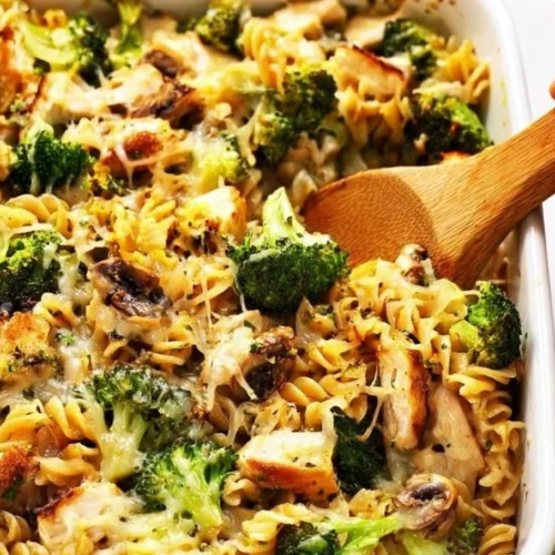 Delicious Broccoli Chicken Casserole topped with cheese and fresh herbs