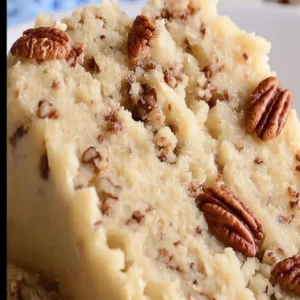 Delicious Butter Pecan Cake with nuts and frosting on a plate