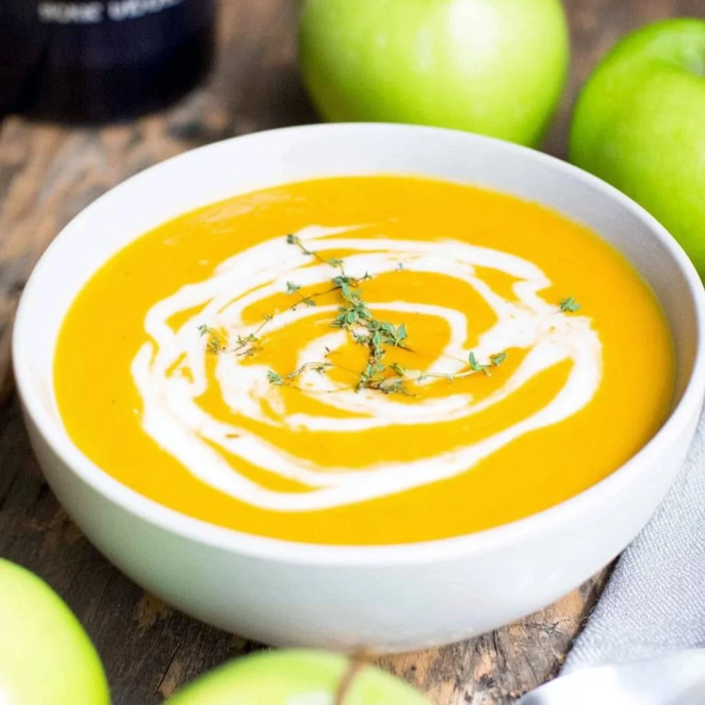Delicious bowl of creamy butternut squash soup garnished with herbs