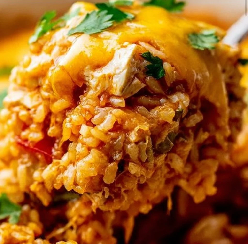 Chicken Enchilada Rice Casserole topped with cheese and fresh cilantro