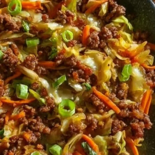 Egg Roll in a Bowl recipe featuring fresh vegetables and savory meats.