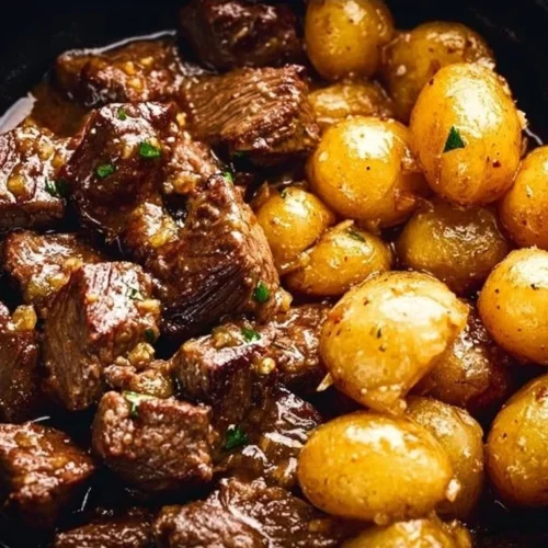Delicious Garlic Butter Beef Bites served with tender potatoes