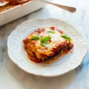 Delicious Italian Eggplant Parmesan fresh out of the oven with cheese and herbs