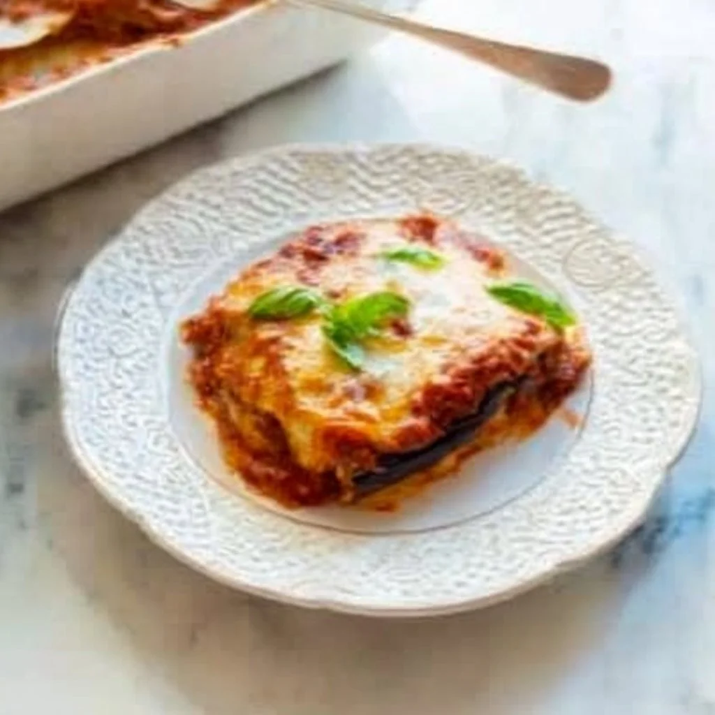 Delicious Italian Eggplant Parmesan fresh out of the oven with cheese and herbs
