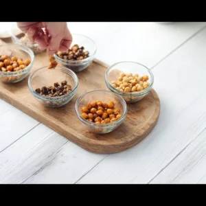 Bowl of roasted chickpeas seasoned with various spices for healthy snacking