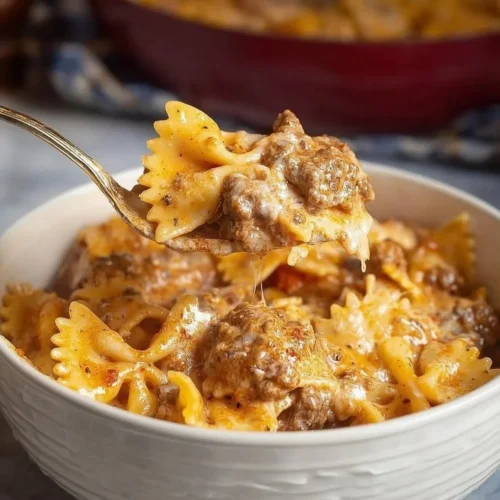 Slow Cooker Million Dollar Pasta featuring creamy sauces and savory ingredients.