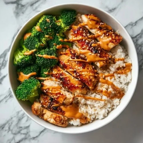 Delicious Sticky Chicken Rice Bowls with vibrant vegetables and savory chicken.