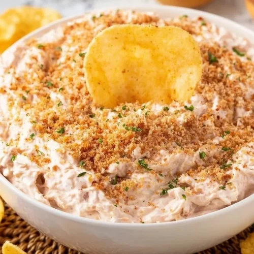 Delicious Bloomin' Onion Dip served in a bowl with crispy chips.