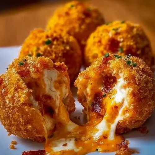 Buffalo Chicken Bombs featuring turkey bacon and mozzarella, perfect for game day snacking.