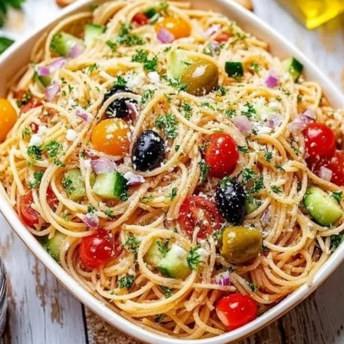 Colorful Cold Spaghetti Salad with fresh vegetables and dressing