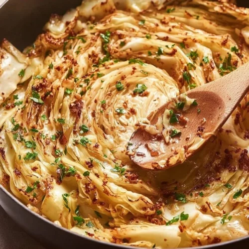 Creamy tomato-kissed cabbage dish served in a bowl