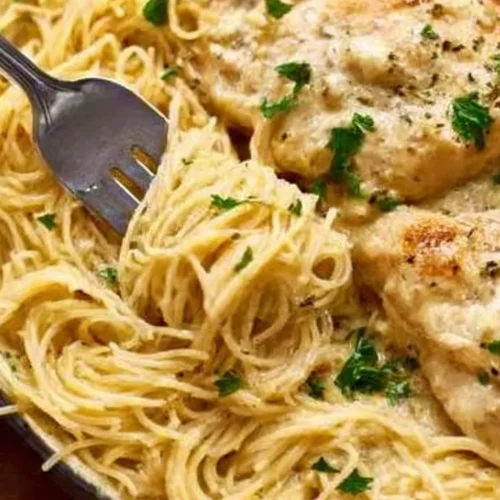 Crock Pot Angel Chicken dish served with herbs and rice