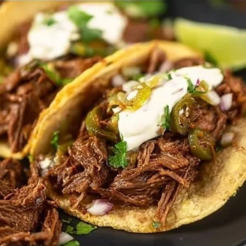 Crock Pot Mexican shredded beef tacos served with fresh toppings