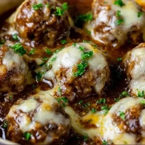 Delicious Crockpot French Onion Meatballs served in a rich broth
