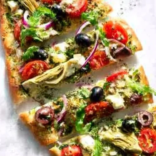 Delicious Greek Flatbread Pizza topped with fresh vegetables and feta cheese
