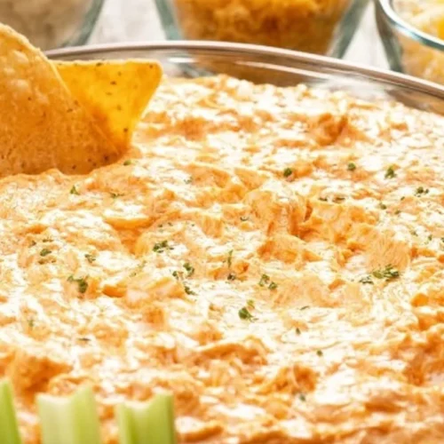 Healthy Greek Yogurt Buffalo Chicken Dip served in a bowl with tortilla chips