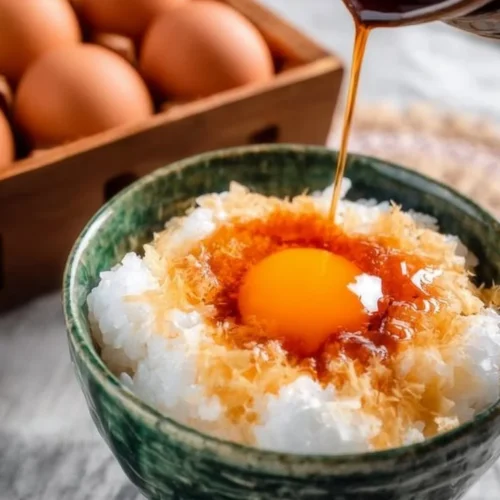 Japanese breakfast egg rice bowl featuring perfectly cooked egg over rice
