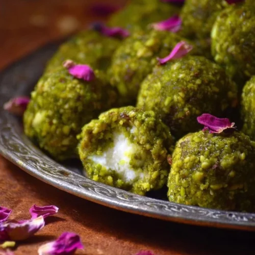 Delicious Mafroukeh Truffles sprinkled with nuts and served on a plate