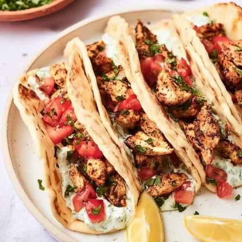 Mediterranean Chicken Tacos with fresh vegetables and herbs