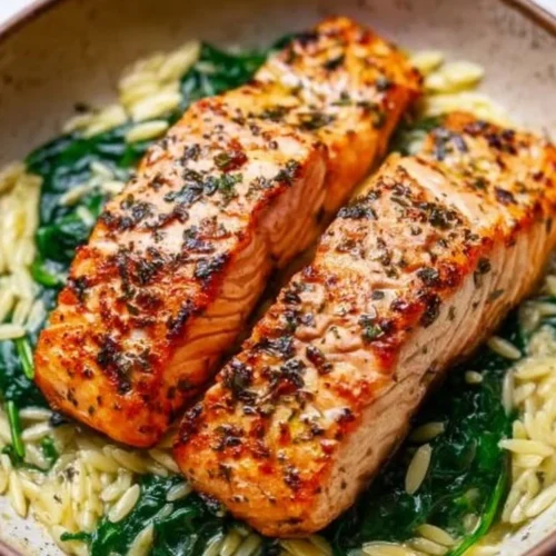 Mediterranean salmon served with lemon orzo on a plate