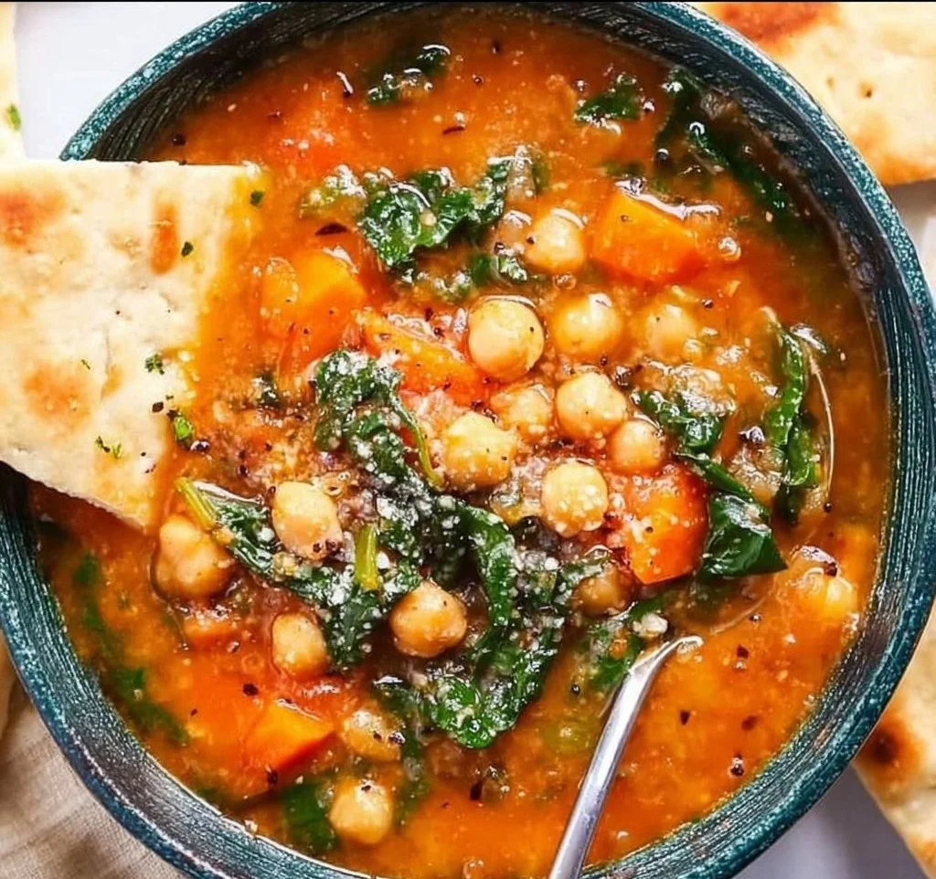 Bowl of flavorful Mediterranean soup with fresh vegetables and herbs