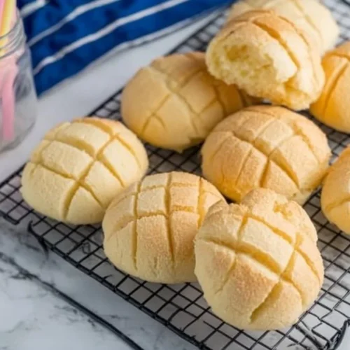 Freshly baked melon bread with a golden buttery crust.