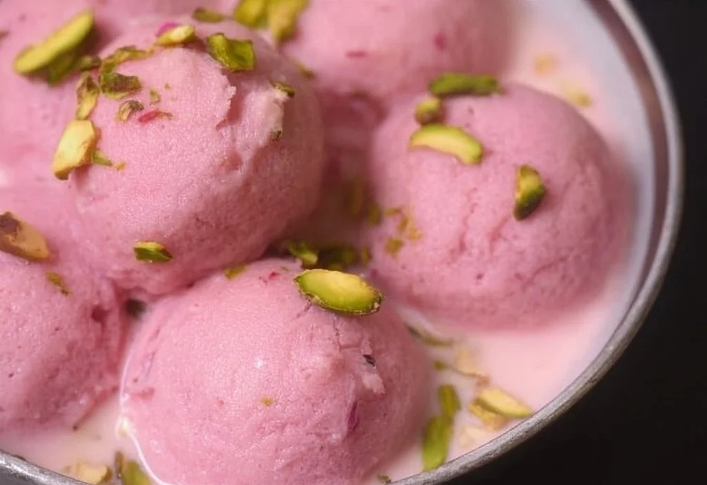 Delicious Rose Rasmalai dessert with rose essence and creamy texture.