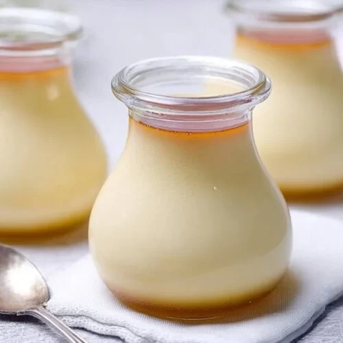 Silky Japanese custard pudding served in a bowl with caramel sauce