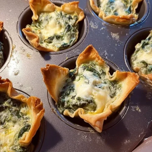 Spinach and artichoke wonton cups served on a platter as a tasty appetizer