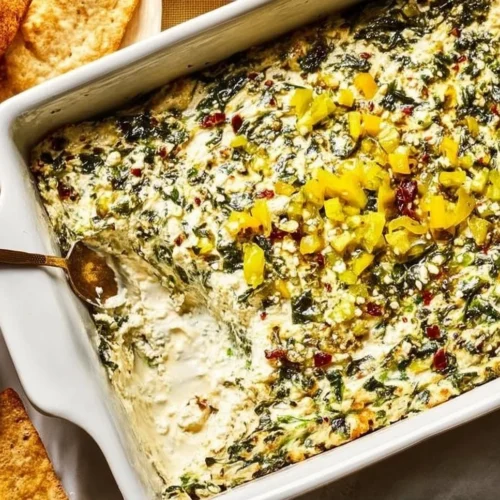 Delicious Spinach and Pepperoncini Baked Feta Dip served with fresh crackers