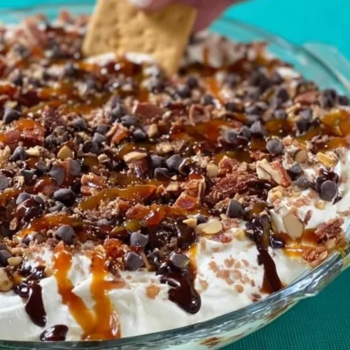 Delicious Turtle Cheesecake Dip served with caramel and pecans