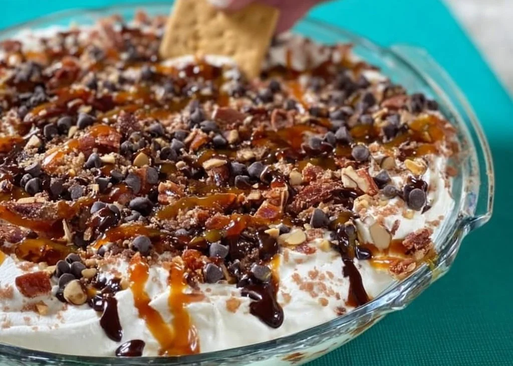 Delicious Turtle Cheesecake Dip served with caramel and pecans