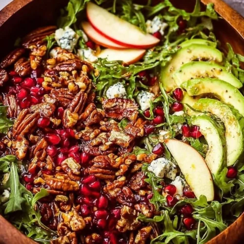 A colorful Winter Christmas Salad with Honey Mustard Dressing, featuring fresh ingredients.