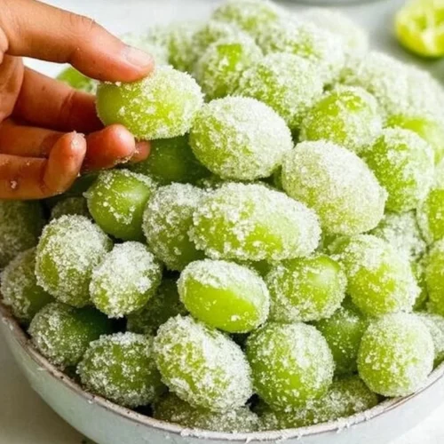 Bowl of 3-ingredient frozen candied grapes ready to serve as a healthy snack.