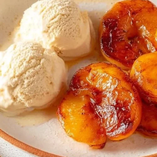 Delicious air fryer cinnamon butter peaches served in a bowl.