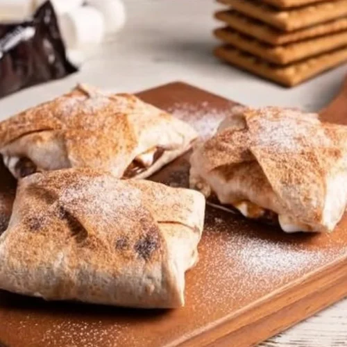 Delicious Air Fryer S'mores Crunch wraps recipe with melted chocolate and marshmallows.