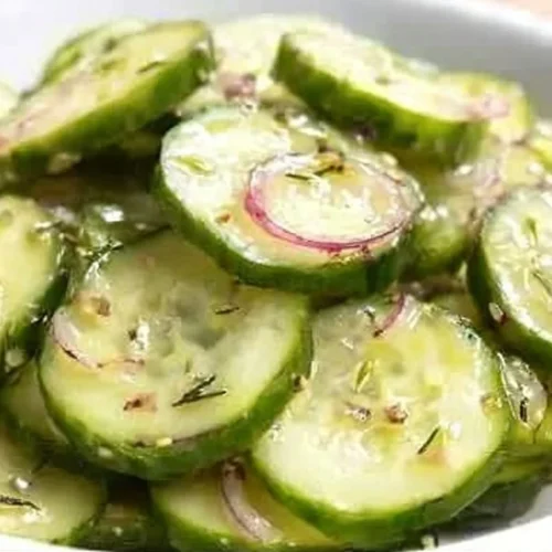 A delicious bowl of apple cider vinegar cucumber salad with fresh vegetables