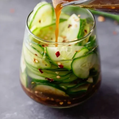 Bowl of Asian pickled cucumber served as a flavorful side dish