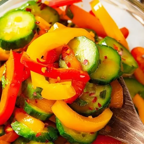 Fresh cucumber and sweet pepper salad served in a bowl