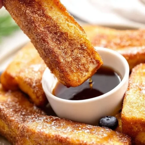 Easy French Toast Sticks served with syrup and fruit
