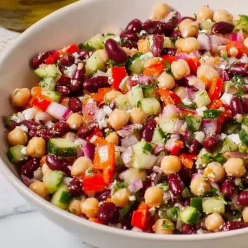 Fresh Greek Bean Salad with colorful vegetables and herbs