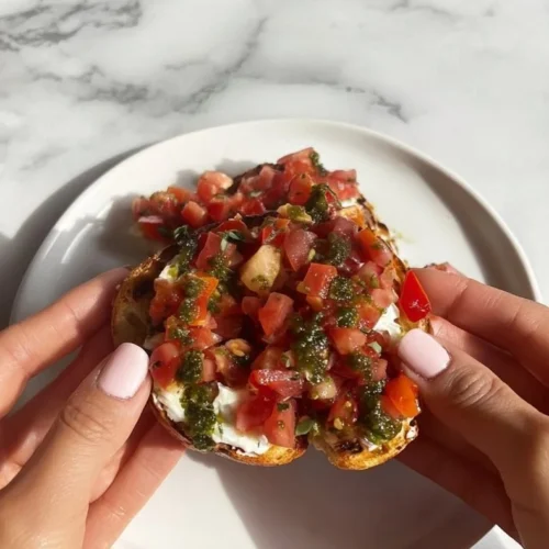 Hearty Caprese Bruschetta topped with fresh tomatoes, basil, and mozzarella on toasted bread.