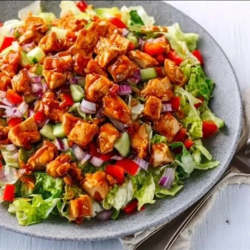 Honey Hot Chicken Salad with fresh greens and spicy chicken