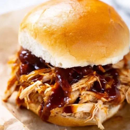 Delicious Instant Pot BBQ chicken served with garnishes.