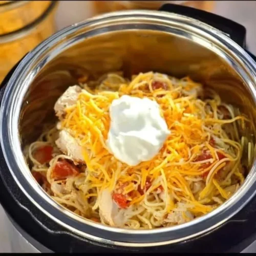 Delicious Instant Pot Creamy Chicken Spaghetti served in a bowl