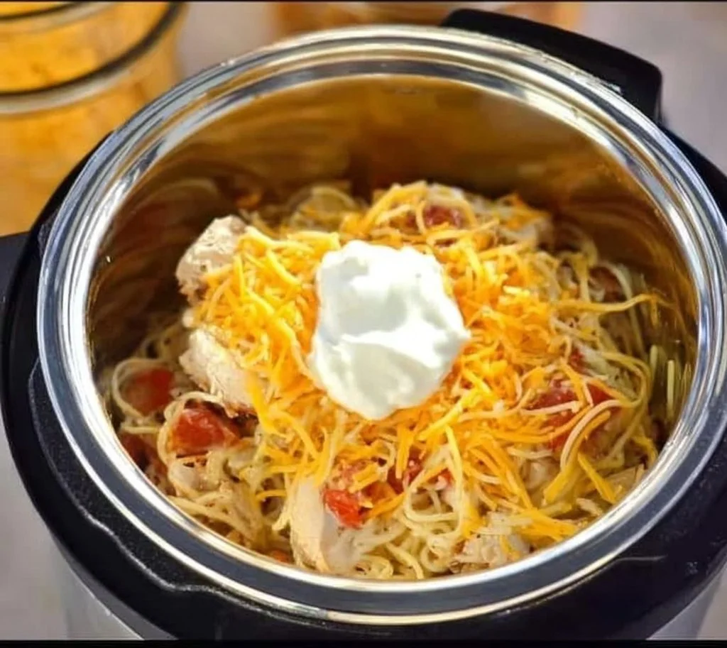 Delicious Instant Pot Creamy Chicken Spaghetti served in a bowl