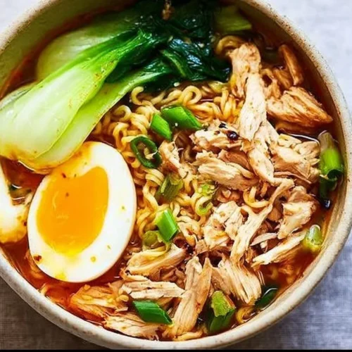 Bowl of homemade Instant Pot Ramen topped with green onions and egg